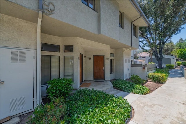 45 Willowcrest Ln, Pomona, CA 91766 - doorway to property featuring stucco siding