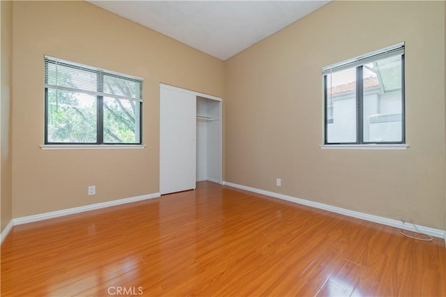 45 Willowcrest Ln, Pomona, CA 91766 - unfurnished bedroom with light wood-style flooring, multiple windows, and a closet