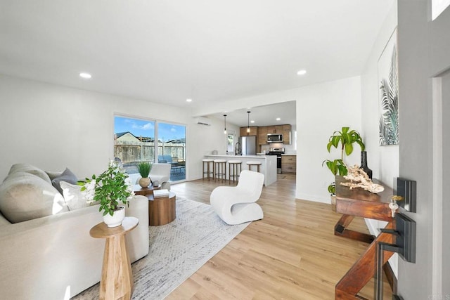 1143 Hemlock Ave, Imperial Beach, CA 91932 - living room with light wood finished floors and recessed lighting