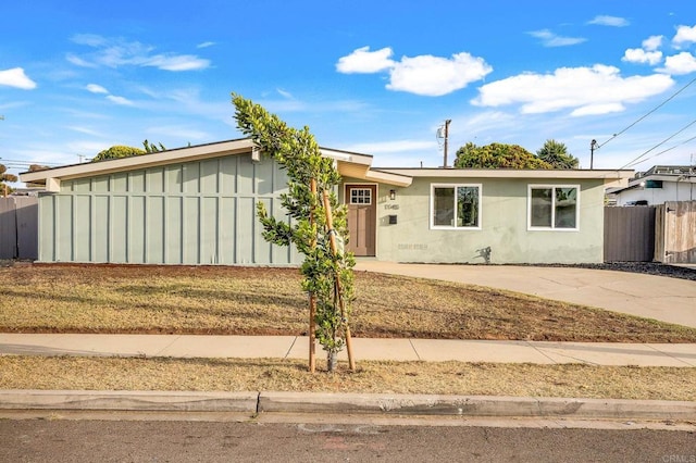 1143 Hemlock Ave, Imperial Beach, CA 91932 - view of front of property with board and batten siding and concrete driveway