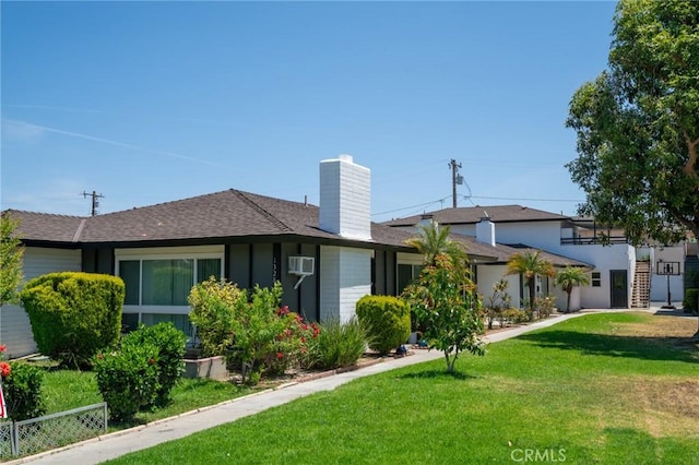 13282 Verde St, Garden Grove, CA 92844 - back of property with a chimney, roof with shingles, and a wall unit AC