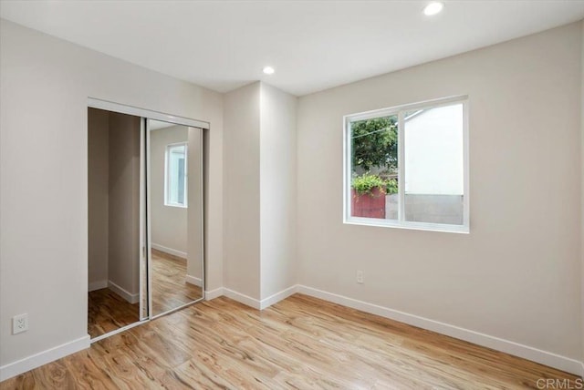 1933 Chatsworth Blvd, San Diego, CA 92107 - unfurnished bedroom with a closet, light wood-style flooring, and recessed lighting