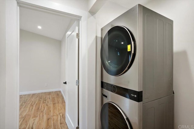 1933 Chatsworth Blvd, San Diego, CA 92107 - washroom featuring stacked washing machine and dryer and light wood-style floors