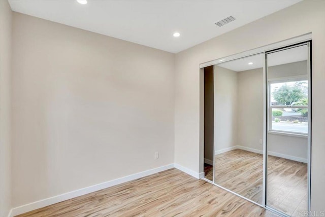 1933 Chatsworth Blvd, San Diego, CA 92107 - unfurnished bedroom featuring a closet, light wood-style flooring, and recessed lighting