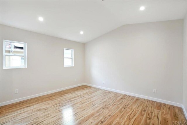1933 Chatsworth Blvd, San Diego, CA 92107 - unfurnished room with light wood finished floors, lofted ceiling, and recessed lighting