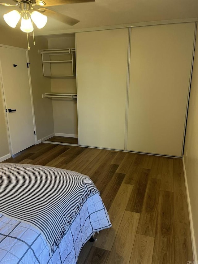 8022 Linda Vista Dr Unit 1G, San Diego, CA 92111 - bedroom with wood finished floors, a closet, and a ceiling fan
