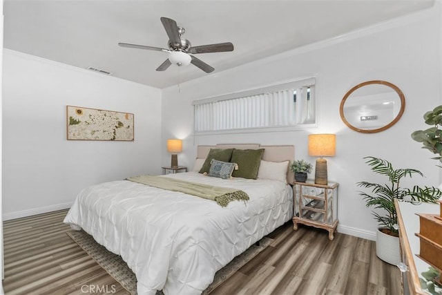 3203 Faust Ave, Long Beach, CA 90808 - bedroom with wood finished floors, crown molding, and a ceiling fan