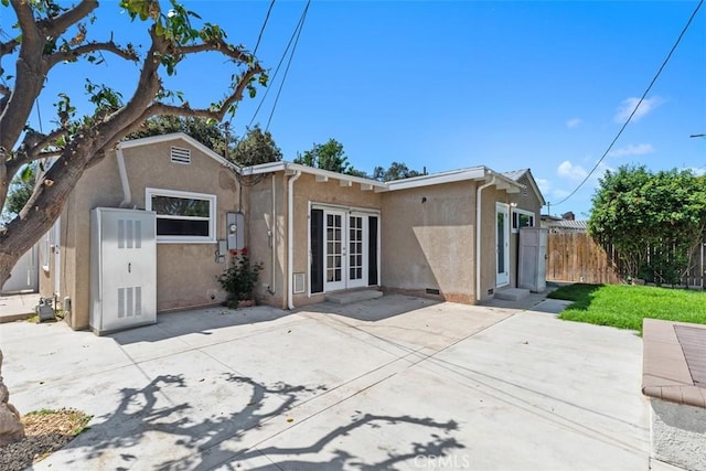 3203 Faust Ave, Long Beach, CA 90808 - rear view of house with french doors, stucco siding, and a patio area