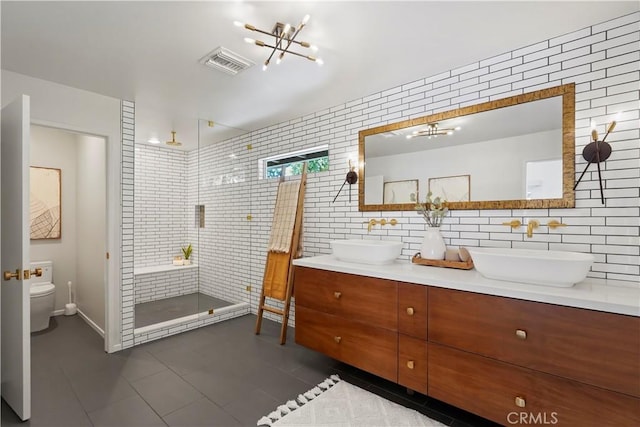 1987 Windover Rd, Pasadena, CA 91107 - full bathroom with tile patterned flooring, double vanity, a stall shower, tile walls, and a chandelier