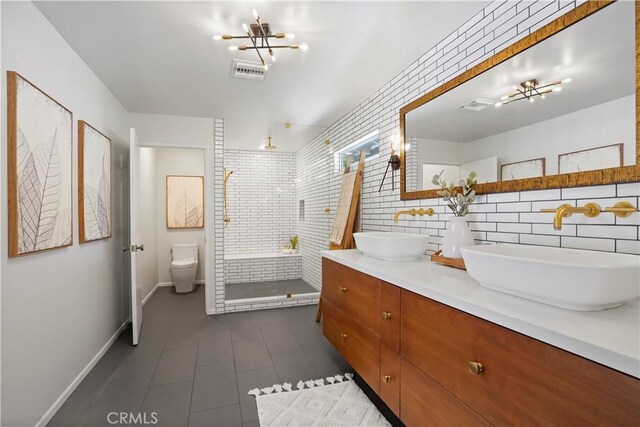 1987 Windover Rd, Pasadena, CA 91107 - bathroom featuring double vanity, tile patterned flooring, a shower stall, a chandelier, and tile walls