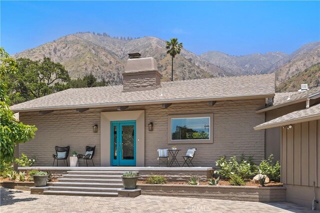 1987 Windover Rd, Pasadena, CA 91107 - view of front of house featuring a chimney, a porch, brick siding, and a mountain view