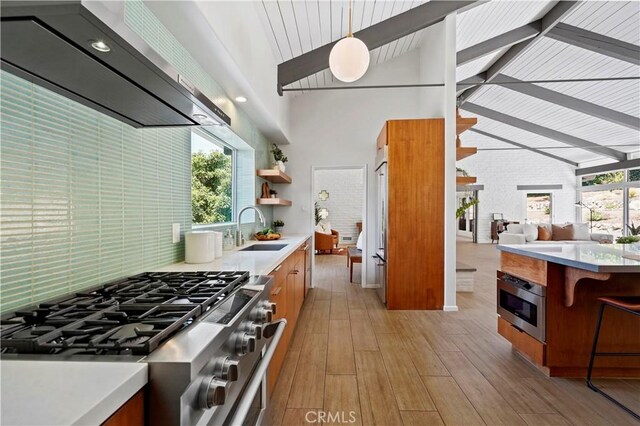1987 Windover Rd, Pasadena, CA 91107 - kitchen featuring range hood, stainless steel appliances, brown cabinets, light countertops, and tasteful backsplash