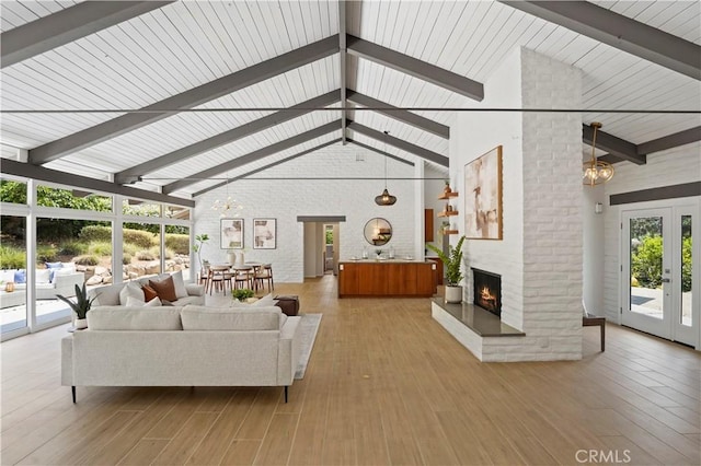 1987 Windover Rd, Pasadena, CA 91107 - living room with a chandelier, beamed ceiling, high vaulted ceiling, a fireplace, and healthy amount of natural light