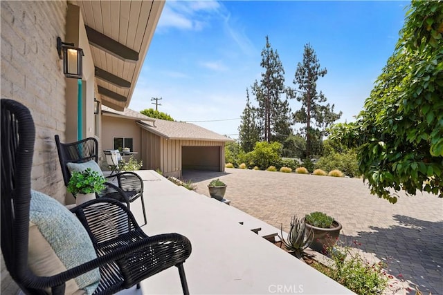 1987 Windover Rd, Pasadena, CA 91107 - view of patio featuring a garage and driveway