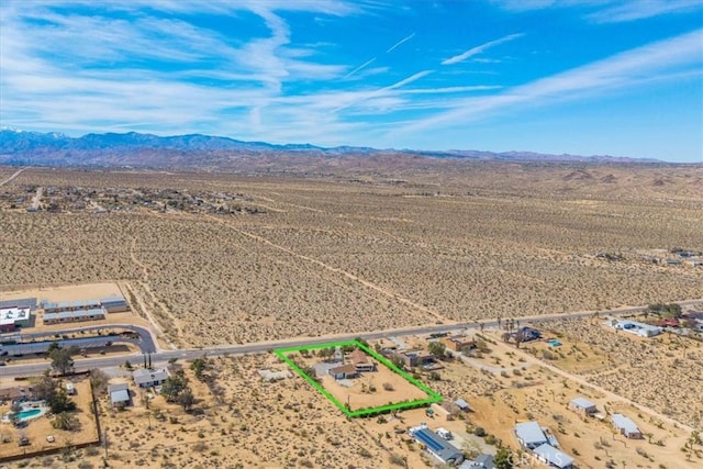 7167 Sunny Vista Rd, Joshua Tree, CA 92252 - aerial view of sparsely populated area featuring a mountain backdrop and property parcel outlined