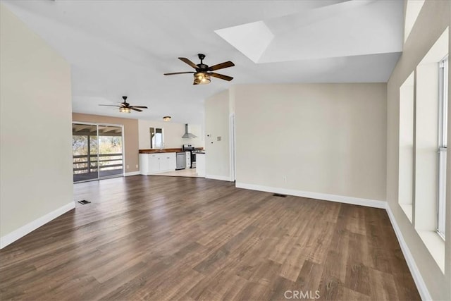 7167 Sunny Vista Rd, Joshua Tree, CA 92252 - unfurnished living room featuring a ceiling fan, dark wood finished floors, and vaulted ceiling