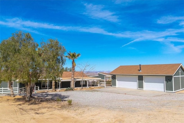 7167 Sunny Vista Rd, Joshua Tree, CA 92252 - single story home featuring driveway, a detached garage, and an outdoor structure