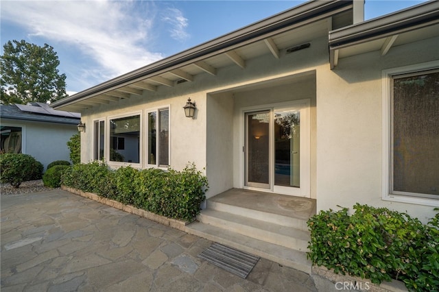 1525 Lafayette Rd, Claremont, CA 91711 - view of exterior entry with stucco siding and a patio