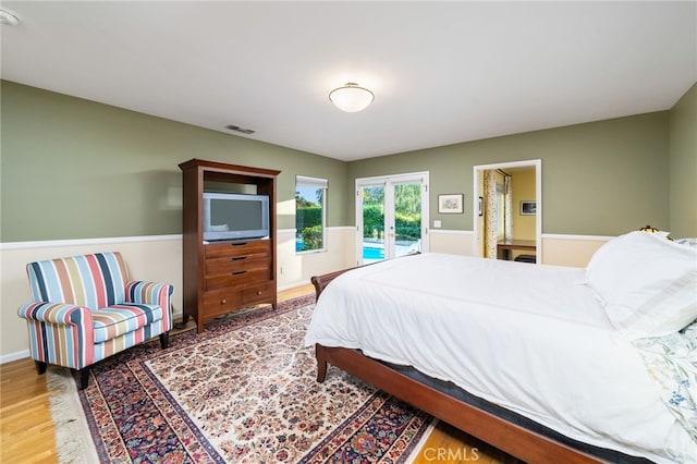 1525 Lafayette Rd, Claremont, CA 91711 - bedroom with access to outside and wood finished floors