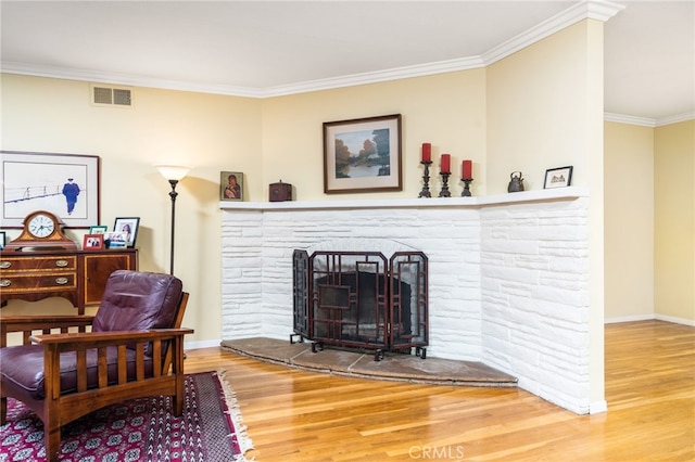 1525 Lafayette Rd, Claremont, CA 91711 - living area with wood finished floors, ornamental molding, and a stone fireplace