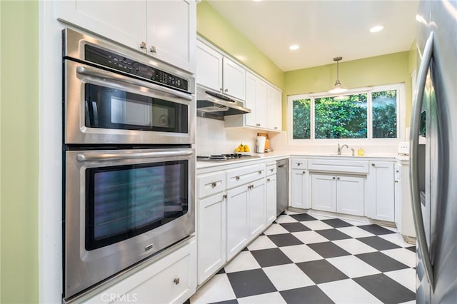 1525 Lafayette Rd, Claremont, CA 91711 - kitchen featuring appliances with stainless steel finishes, tile patterned floors, under cabinet range hood, white cabinetry, and light countertops