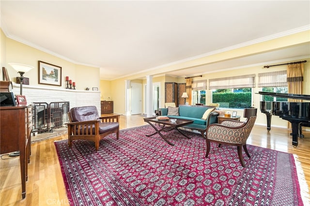 1525 Lafayette Rd, Claremont, CA 91711 - living area with a fireplace, ornamental molding, light wood-style floors, and decorative columns