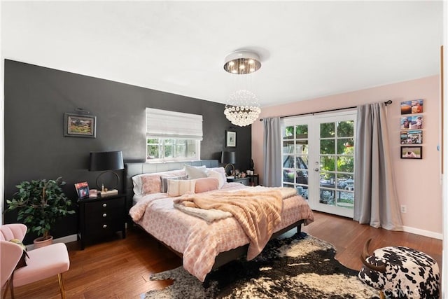 1640 Corsica Pl, Costa Mesa, CA 92626 - bedroom featuring a chandelier, access to outside, french doors, and wood finished floors