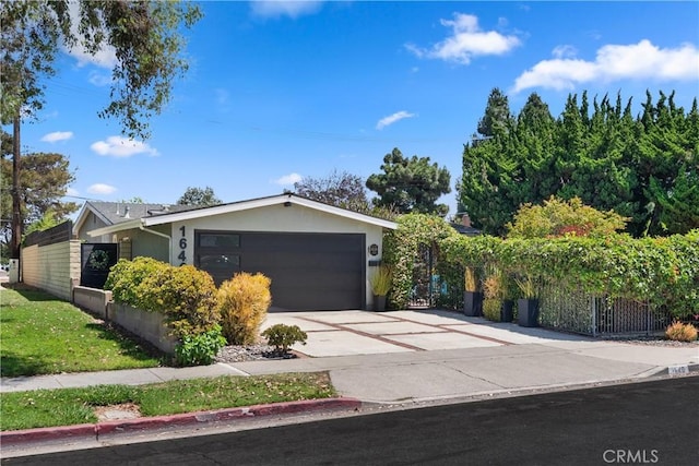1640 Corsica Pl, Costa Mesa, CA 92626 - view of front of home with a garage, driveway, and stucco siding