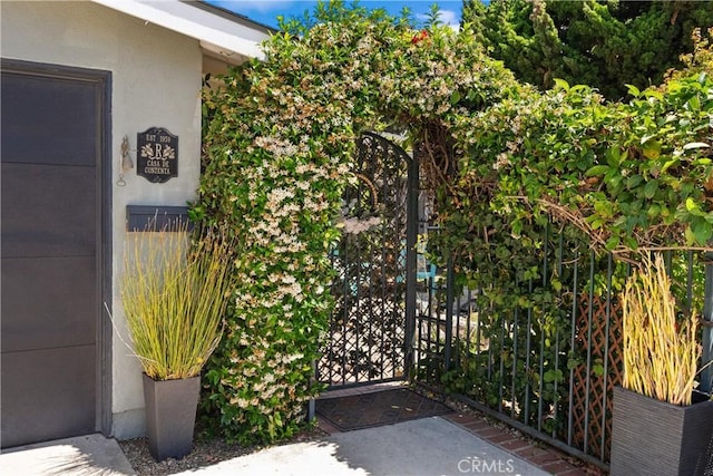 1640 Corsica Pl, Costa Mesa, CA 92626 - view of exterior entry featuring a gate and stucco siding