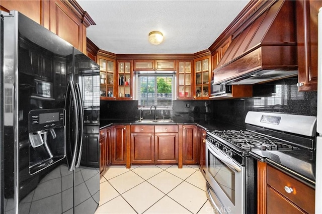 6362 Darlington Ave, Buena Park, CA 90621 - kitchen with black fridge with ice dispenser, stainless steel range with gas cooktop, premium range hood, and dark countertops