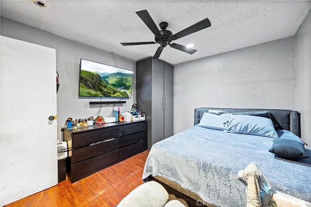 6362 Darlington Ave, Buena Park, CA 90621 - bedroom featuring wood finished floors, a ceiling fan, and a textured ceiling