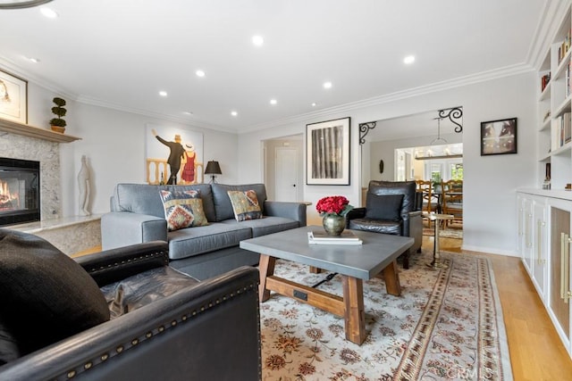 34875 Calle Del Sol, Dana Point, CA 92624 - living room featuring recessed lighting, ornamental molding, a fireplace, and light wood-style flooring