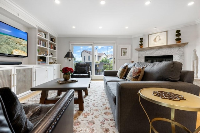 34875 Calle Del Sol, Dana Point, CA 92624 - living area with ornamental molding, a premium fireplace, recessed lighting, and built in shelves