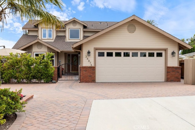 34875 Calle Del Sol, Dana Point, CA 92624 - view of front of house with brick siding, roof with shingles, decorative driveway, and a garage