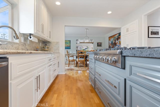 34875 Calle Del Sol, Dana Point, CA 92624 - kitchen featuring light wood-style flooring, white cabinets, dishwasher, backsplash, and recessed lighting