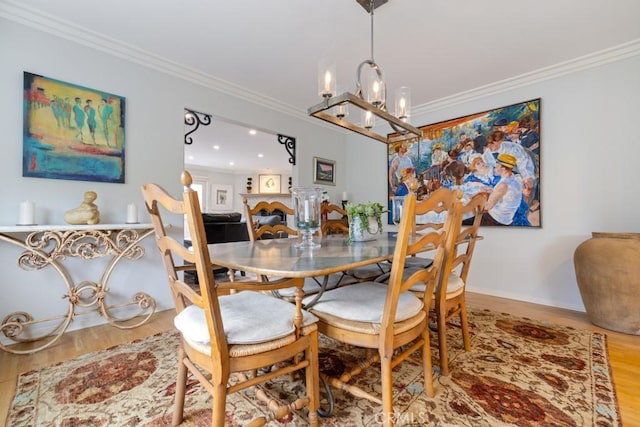 34875 Calle Del Sol, Dana Point, CA 92624 - dining room featuring a chandelier, wood finished floors, and ornamental molding