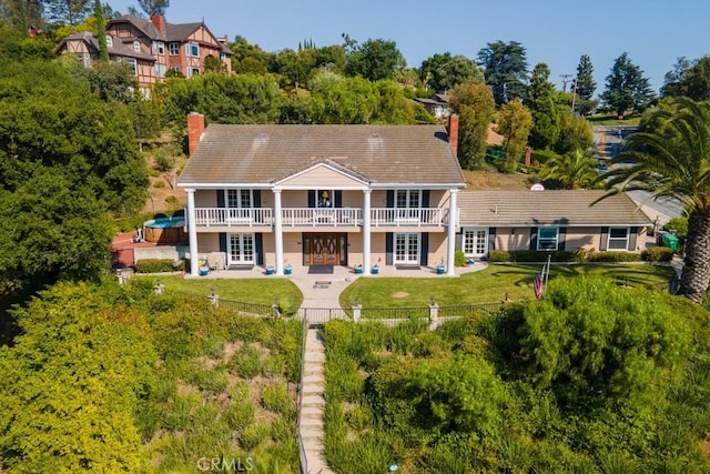 748 S Walnut Ave, San Dimas, CA 91773 - rear view of property featuring french doors, a patio, and a chimney