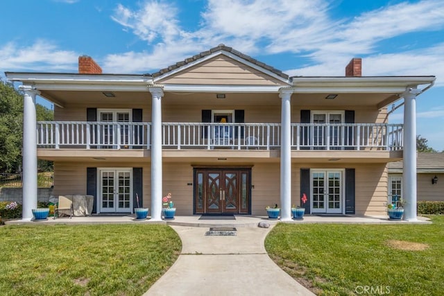 748 S Walnut Ave, San Dimas, CA 91773 - view of front of home with french doors, a chimney, and a balcony