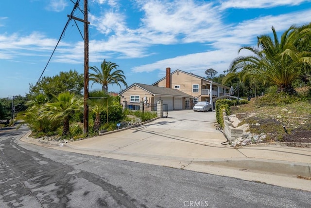 748 S Walnut Ave, San Dimas, CA 91773 - view of front of house with concrete driveway and a garage
