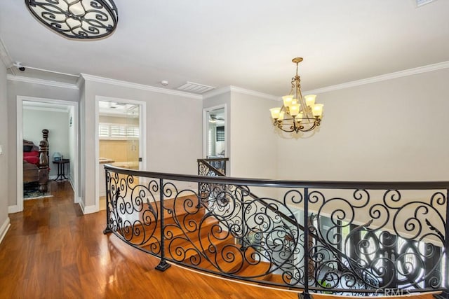 748 S Walnut Ave, San Dimas, CA 91773 - corridor with dark wood-type flooring, crown molding, a chandelier, and an upstairs landing