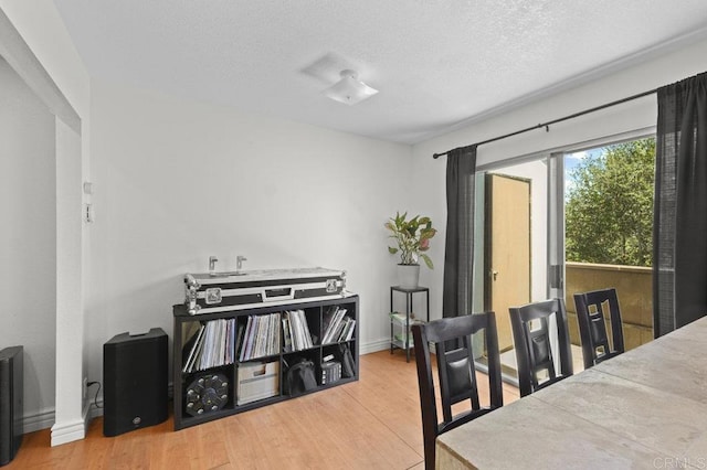 1317 Caminito Gabaldon Unit H, San Diego, CA 92108 - dining space featuring wood finished floors and a textured ceiling