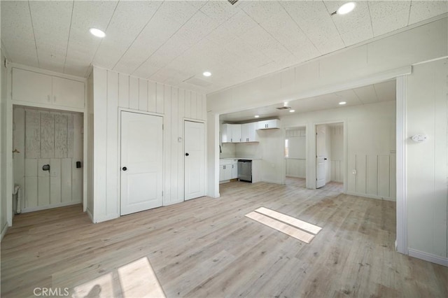 7888 Victor, Yucca Valley, CA 92284 - unfurnished living room with light wood finished floors, recessed lighting, and a decorative wall