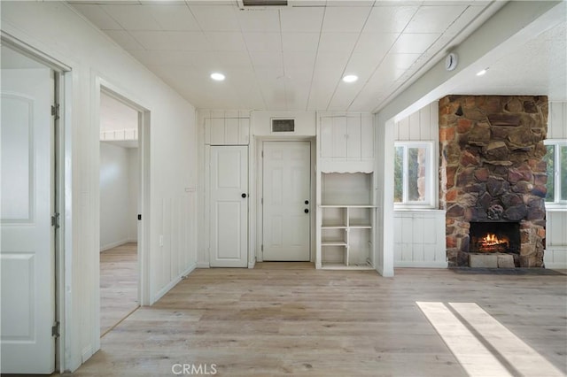 7888 Victor, Yucca Valley, CA 92284 - foyer with wood finished floors, plenty of natural light, a fireplace, and recessed lighting