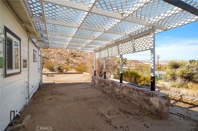7888 Victor, Yucca Valley, CA 92284 - view of patio / terrace with a mountain view and a pergola