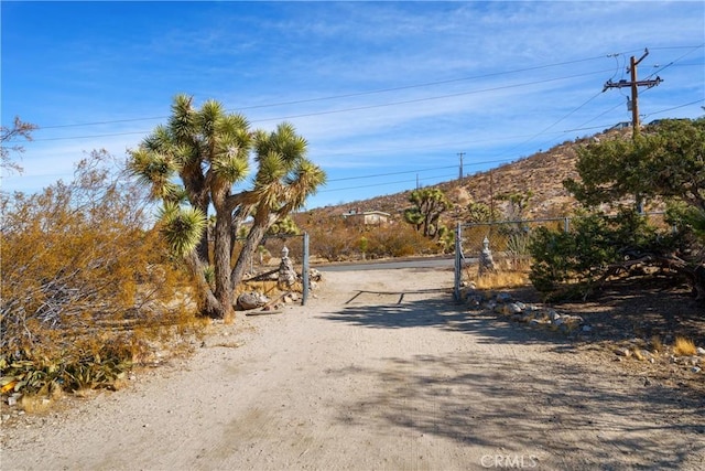 7888 Victor, Yucca Valley, CA 92284 - view of road featuring a gated entry