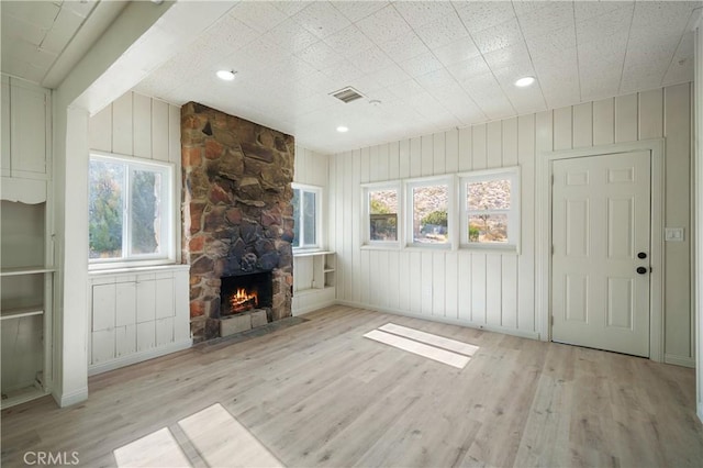 7888 Victor, Yucca Valley, CA 92284 - unfurnished living room with light wood-style flooring, a fireplace, and recessed lighting