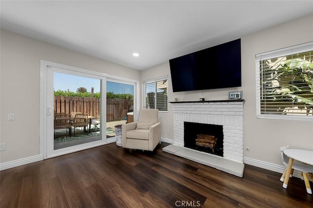 4773 Adler, Oceanside, CA 92057 - living area with wood finished floors, a brick fireplace, and recessed lighting