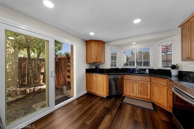4773 Adler, Oceanside, CA 92057 - kitchen featuring appliances with stainless steel finishes, dark wood-style flooring, dark countertops, recessed lighting, and brown cabinets