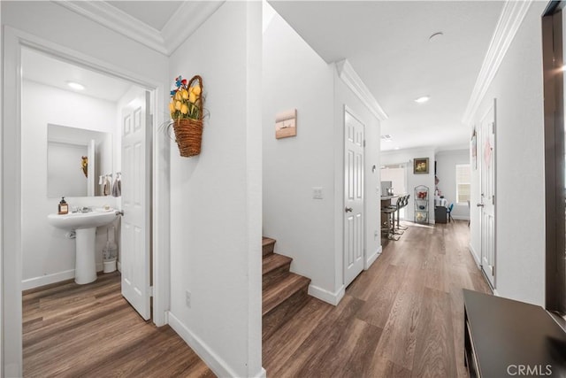 9804 Ardisia St, Riverside, CA 92503 - corridor featuring ornamental molding, wood finished floors, stairway, and recessed lighting