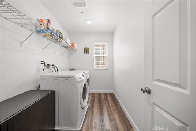 9804 Ardisia St, Riverside, CA 92503 - washroom featuring washing machine and clothes dryer and dark wood-style floors